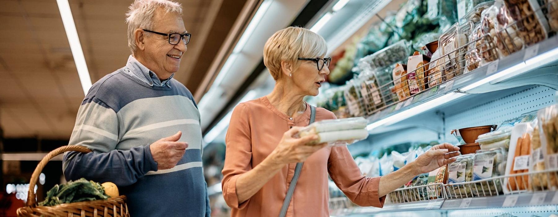 a man and woman grocery shopping
