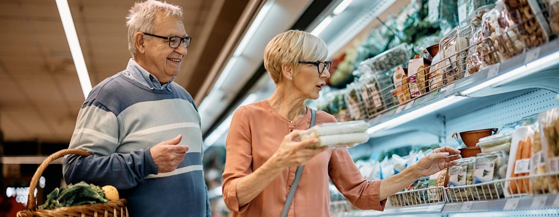 a man and woman grocery shopping